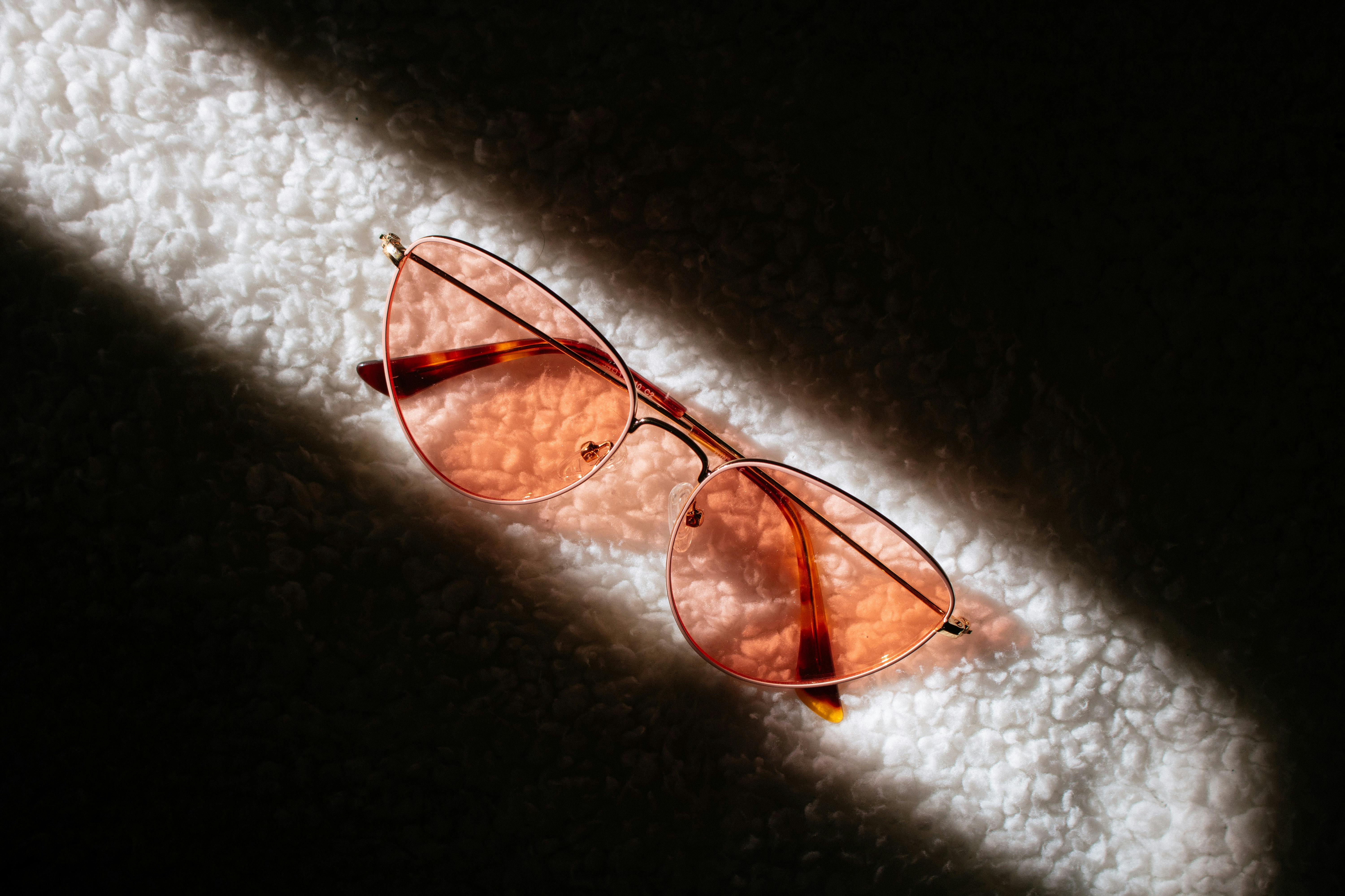 Close-up of colored eyewear lenses with light passing through