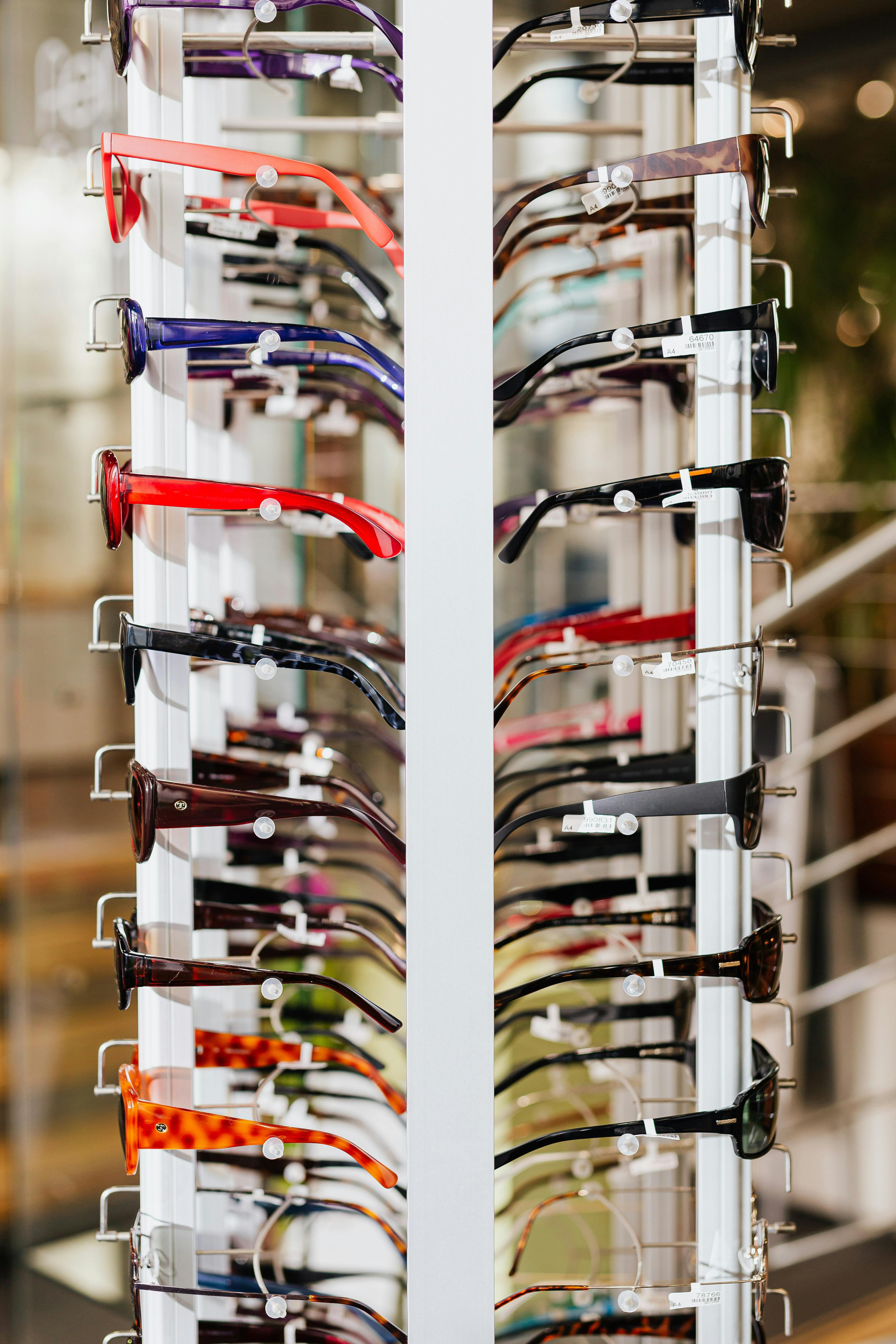 Interior of an independent optical shop, frames displayed, warm light